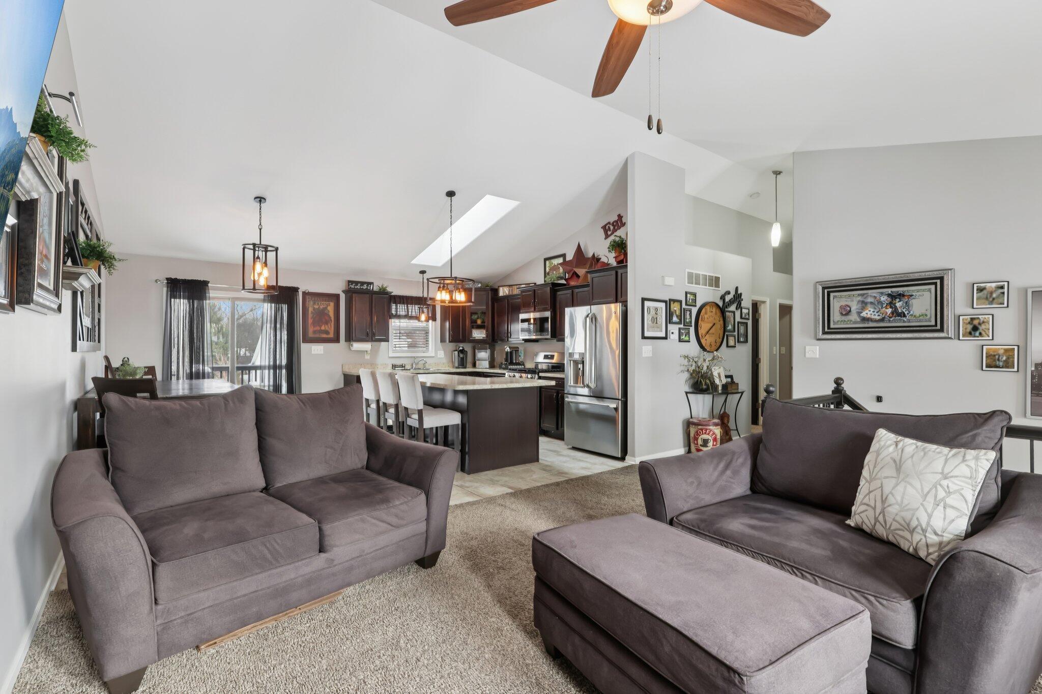 2235 Coldspring Road Crown Point, IN 46307 - Photo 7 of 51 a living room with furniture and a chandelier