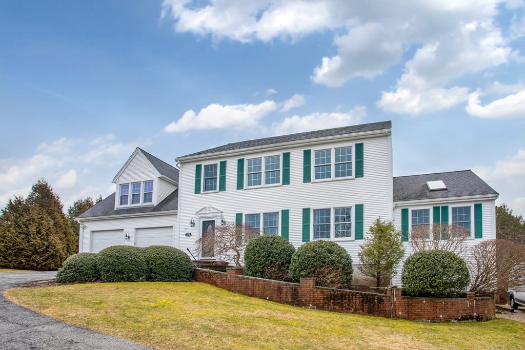 2 Desmond Road Bourne, MA 02561 - Photo 1 of 26 a front view of house with yard and trees around