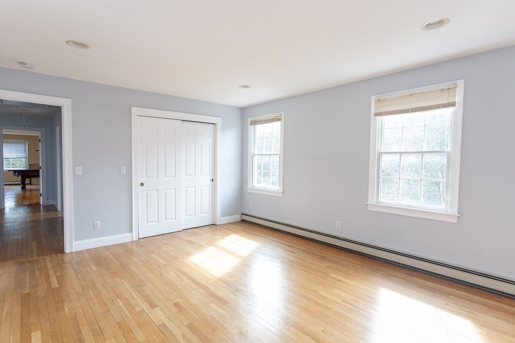 2 Desmond Road Bourne, MA 02561 - Photo 21 of 26 a view of an empty room with wooden floor and a window