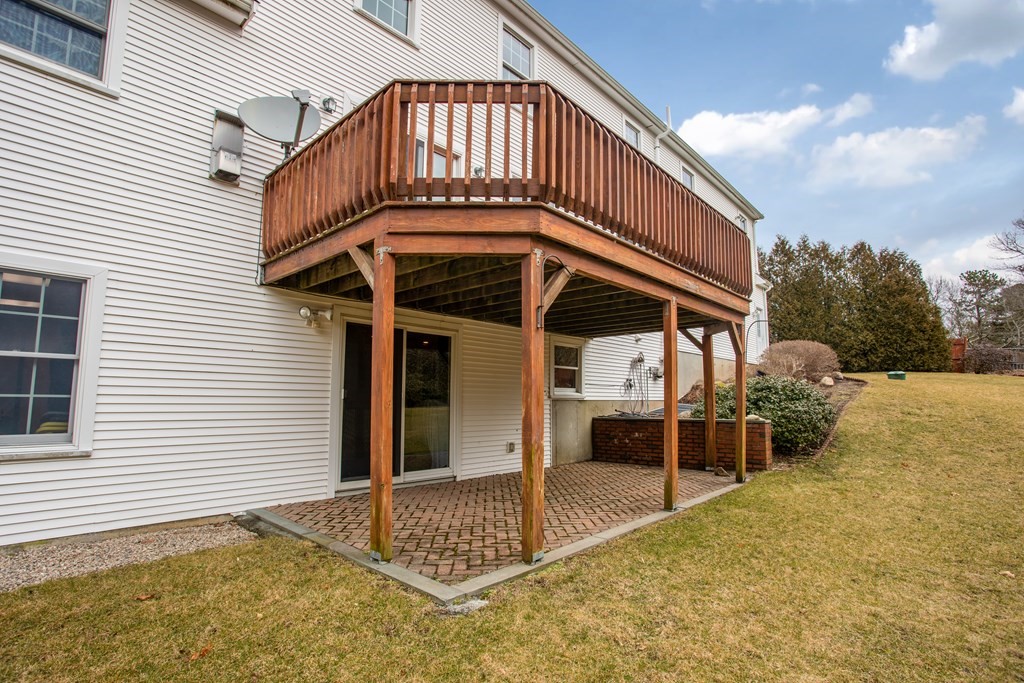 2 Desmond Road Bourne, MA 02561 - Photo 4 of 26 a view of a house with wooden walls