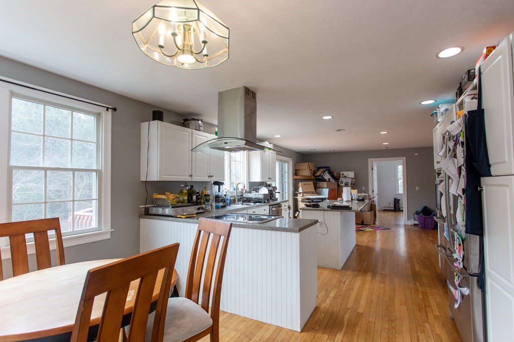 2 Desmond Road Bourne, MA 02561 - Photo 6 of 26 a kitchen with sink refrigerator dining table and chairs