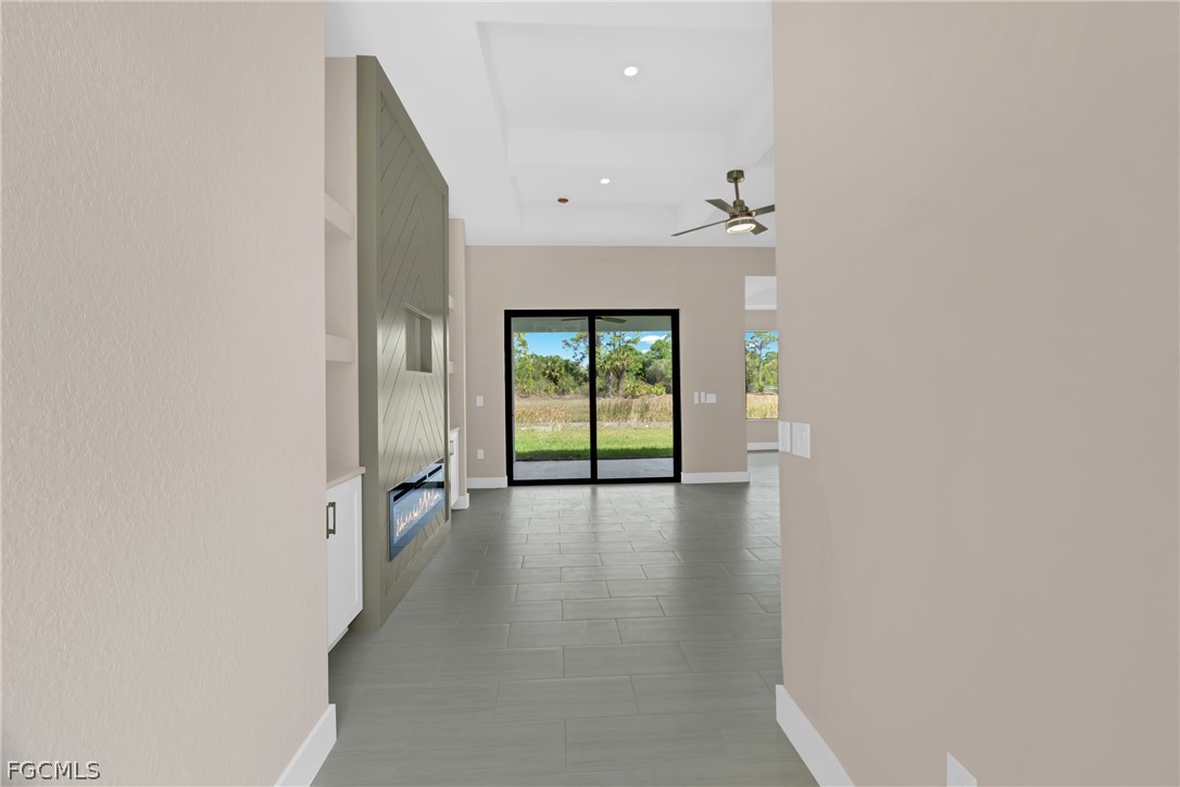 6029 Keystone Circle LaBelle, FL 33935 - Photo 6 of 50 an empty room with wooden floor and windows