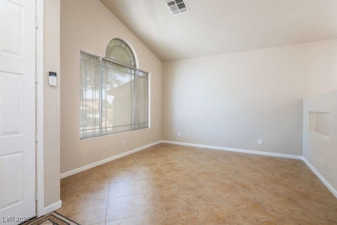 284 Pointe Ranier Avenue Henderson, NV 89012 - Photo 3 of 39 Front living room by the entry door.