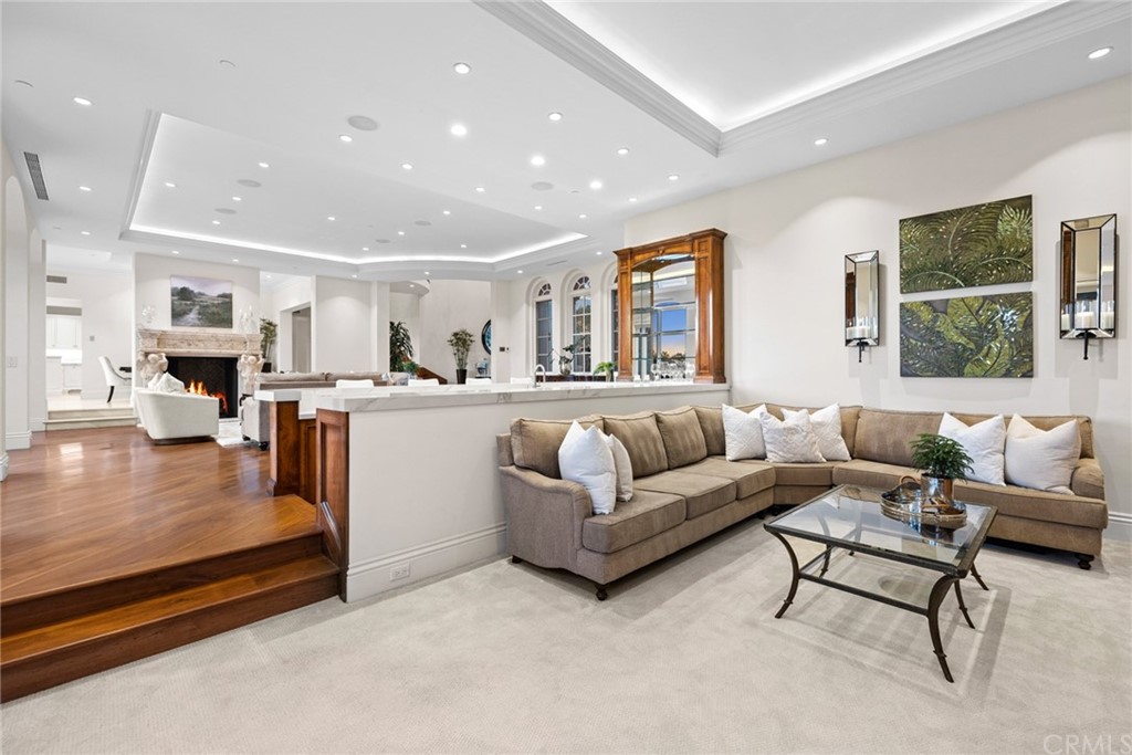 3 Burning Tree Circle Newport Beach, CA 92660 - Photo 17 of 65 a living room with furniture and a large window