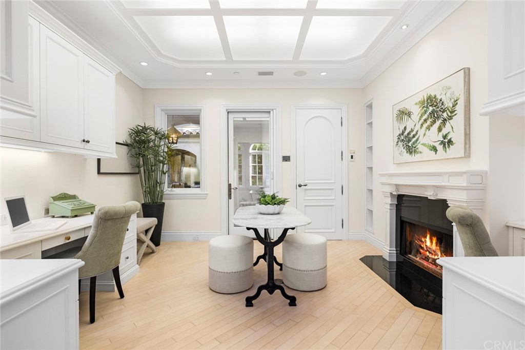 3 Burning Tree Circle Newport Beach, CA 92660 - Photo 28 of 65 a living room with furniture and a fireplace