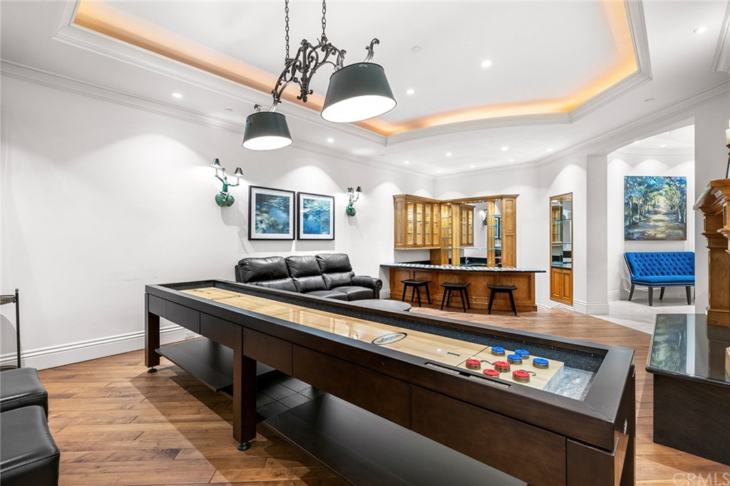 3 Burning Tree Circle Newport Beach, CA 92660 - Photo 47 of 65 a kitchen with granite countertop a stove and white cabinets