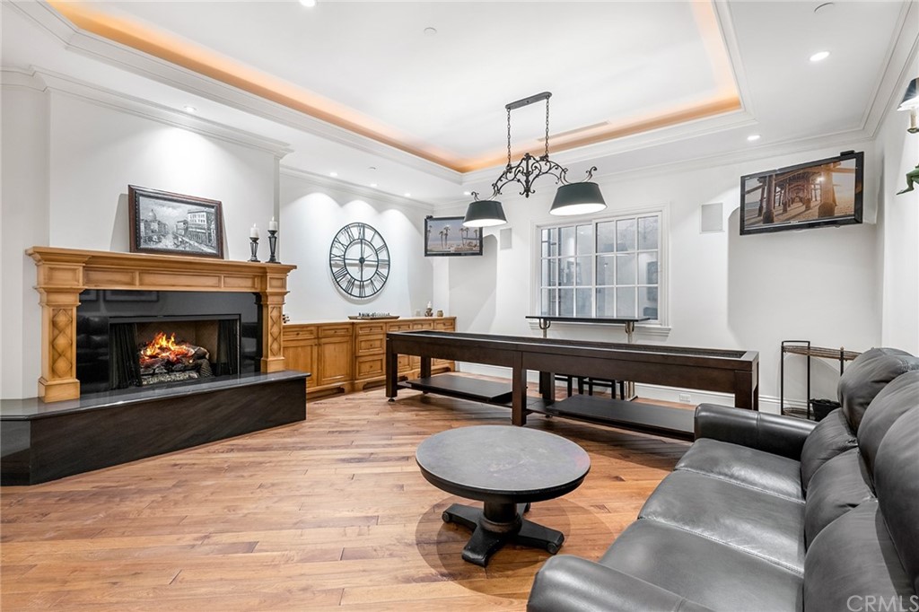 3 Burning Tree Circle Newport Beach, CA 92660 - Photo 48 of 65 a living room with furniture and a fireplace