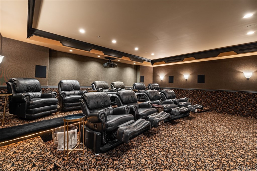 3 Burning Tree Circle Newport Beach, CA 92660 - Photo 49 of 65 a media room with lots of chairs and mirrors