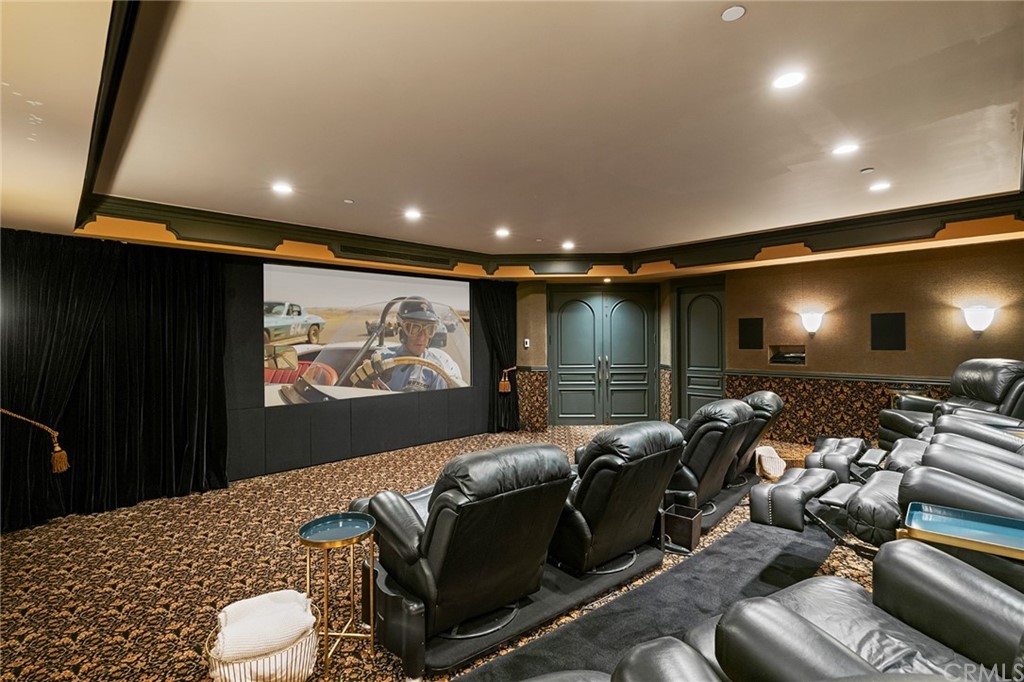 3 Burning Tree Circle Newport Beach, CA 92660 - Photo 50 of 65 a media room with lots of chairs and a projector screen