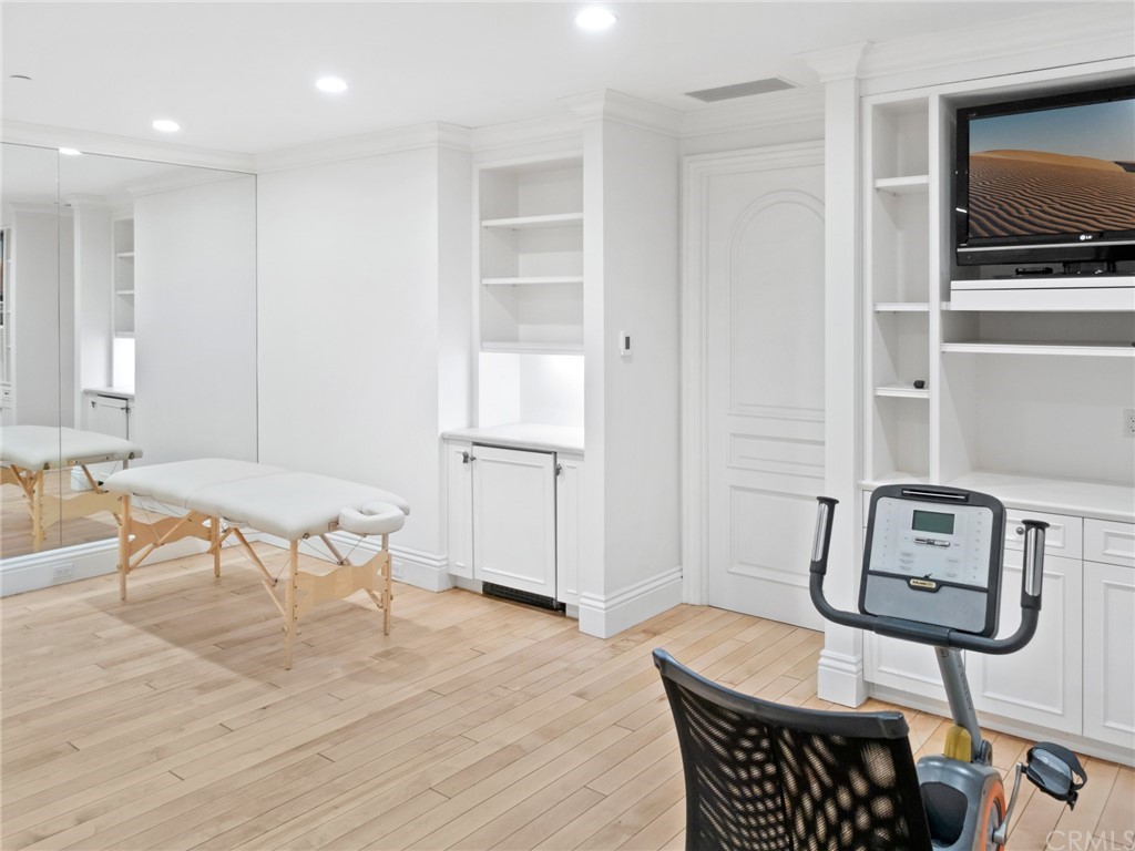 3 Burning Tree Circle Newport Beach, CA 92660 - Photo 52 of 65 a living room with furniture and a flat screen tv