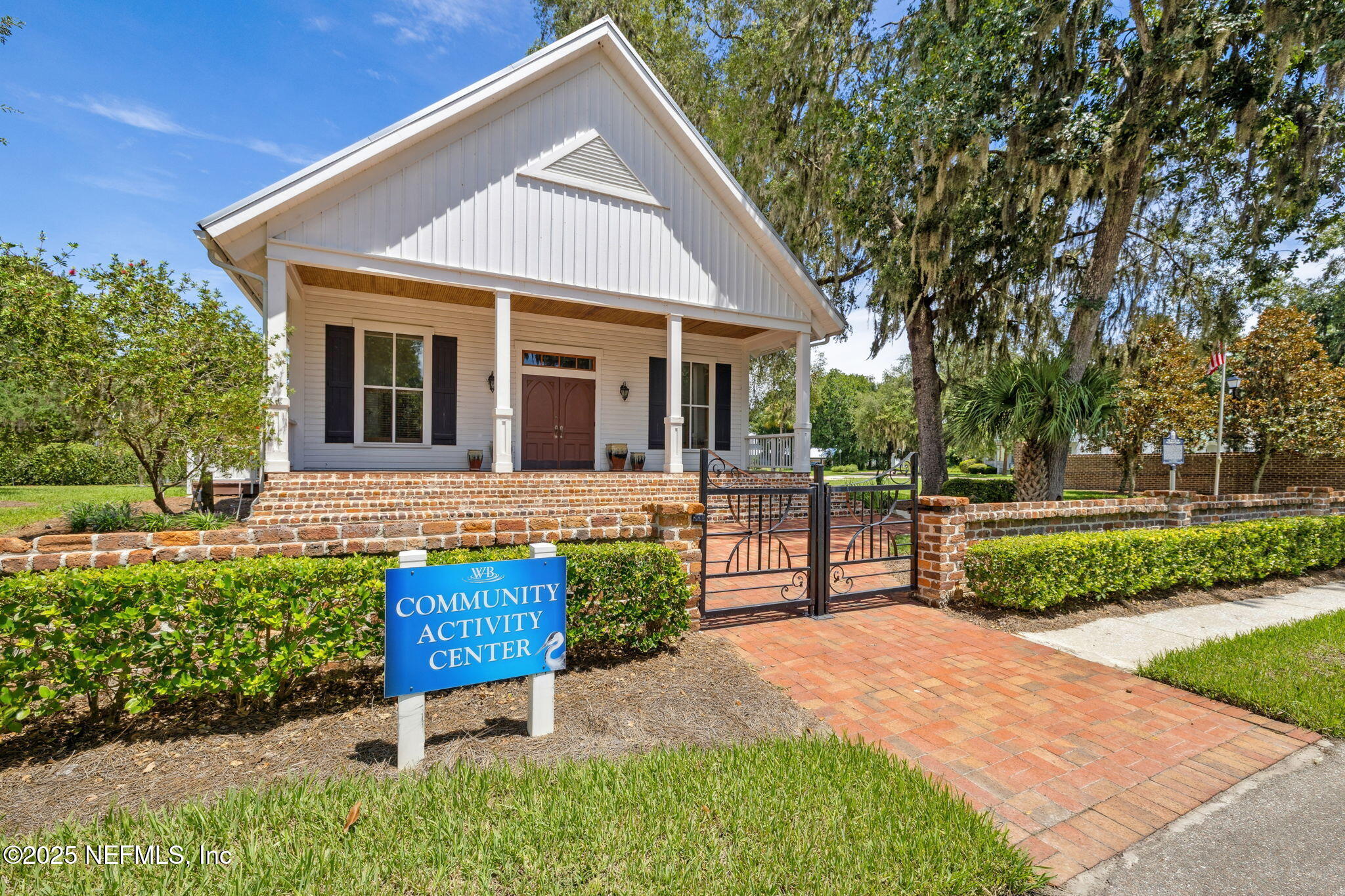 29155 Grandview Manor Yulee, FL 32097 - Photo 12 of 45 a front view of a house with a garden and trees