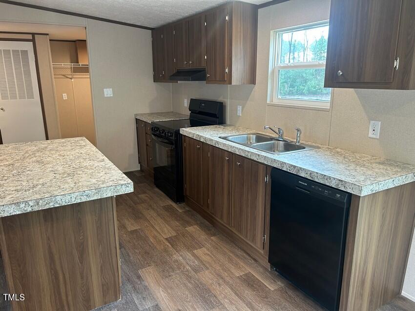 3330 North McCullen Road Faison, NC 28341 - Photo 11 of 31 a kitchen with a sink stove and cabinets