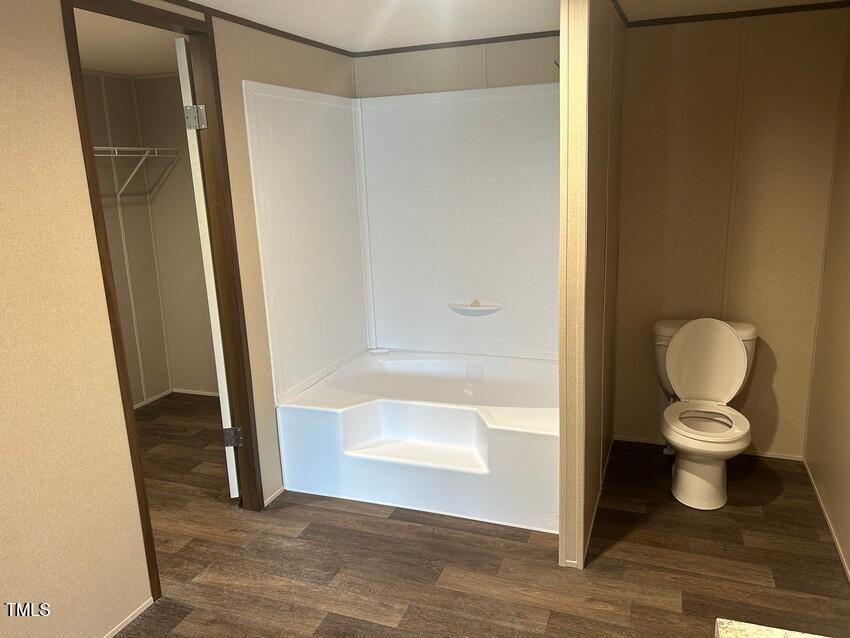3330 North McCullen Road Faison, NC 28341 - Photo 17 of 31 a bathroom with a toilet and a glass door shower