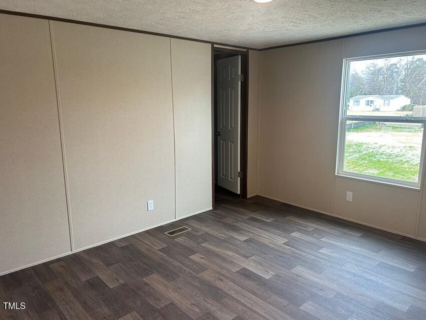 3330 North McCullen Road Faison, NC 28341 - Photo 20 of 31 a view of an empty room with a window