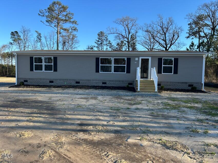 3330 North McCullen Road Faison, NC 28341 - Photo 29 of 31 a view of a house with a backyard