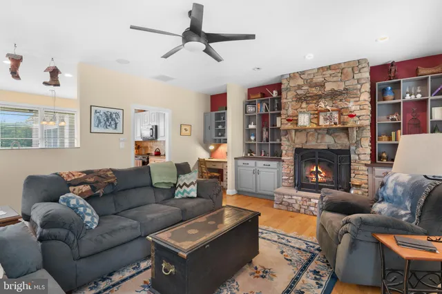 a bathroom with a sink a large mirror a toilet and a bathtub