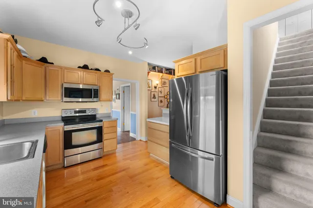 a view of a patio with a table chairs and a backyard