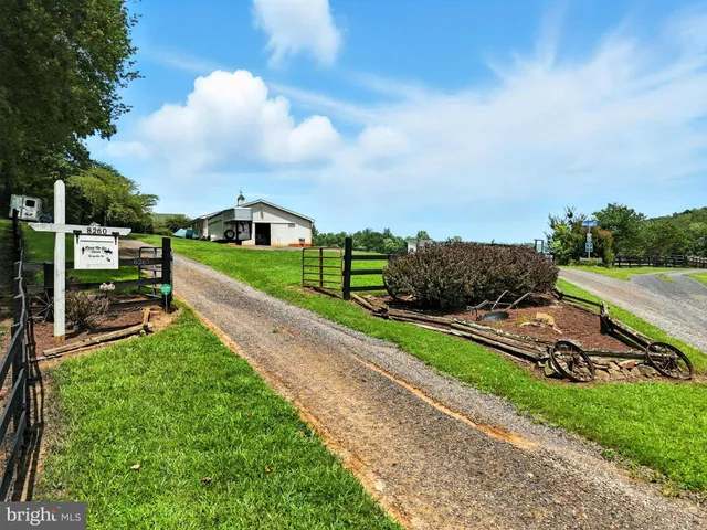 a view of a garden with houses in the background