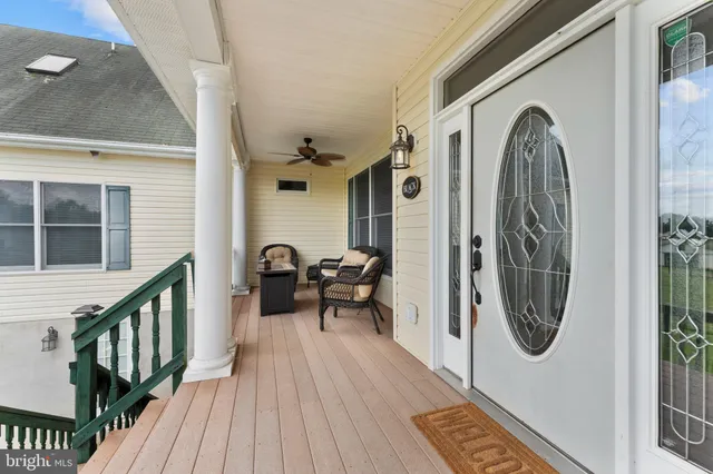 a open kitchen with stainless steel appliances kitchen island granite countertop a refrigerator and microwave