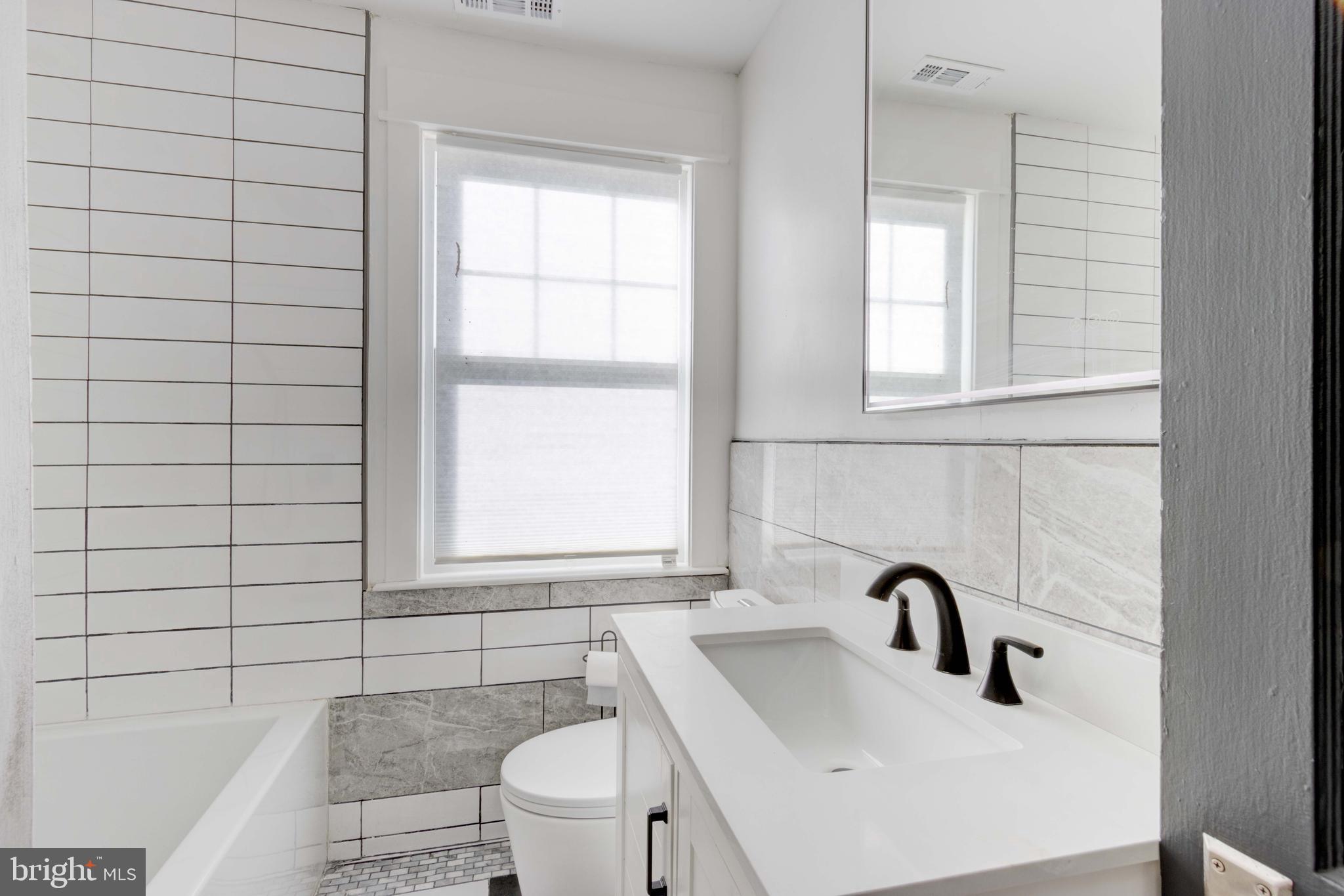 127 Cherrydell Road Catonsville, MD 21228 - Photo 12 of 24 a bathroom with a sink and a toilet