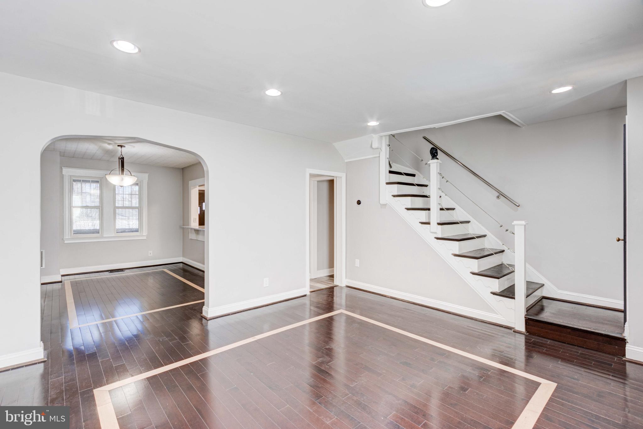 127 Cherrydell Road Catonsville, MD 21228 - Photo 3 of 24 an entryway in a hall with a window and wooden floor