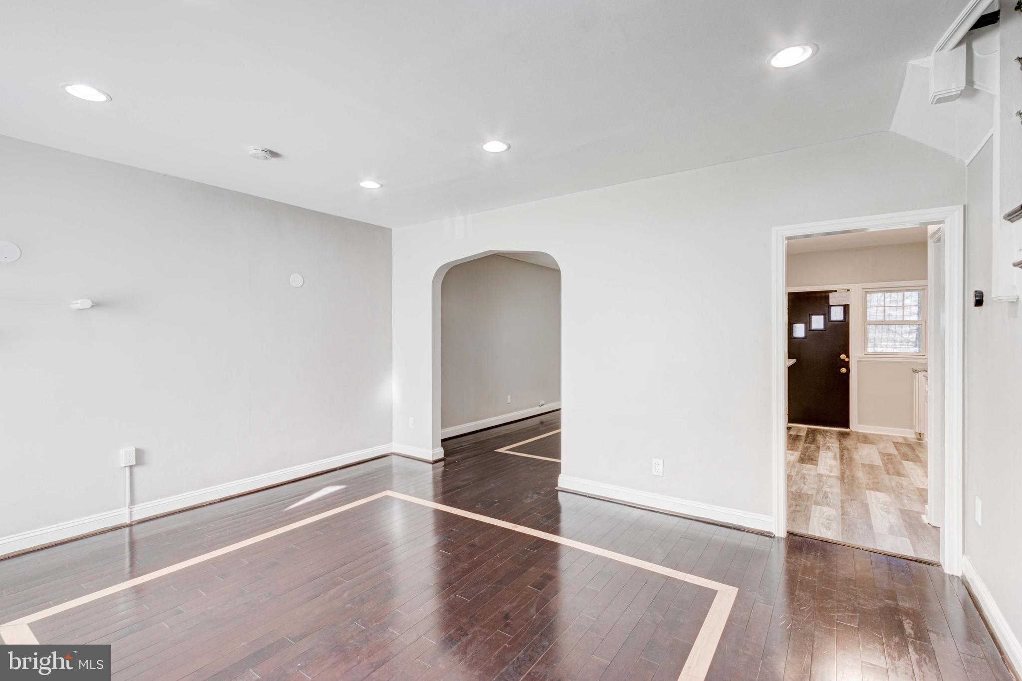 127 Cherrydell Road Catonsville, MD 21228 - Photo 4 of 24 a view of an empty room with wooden floor