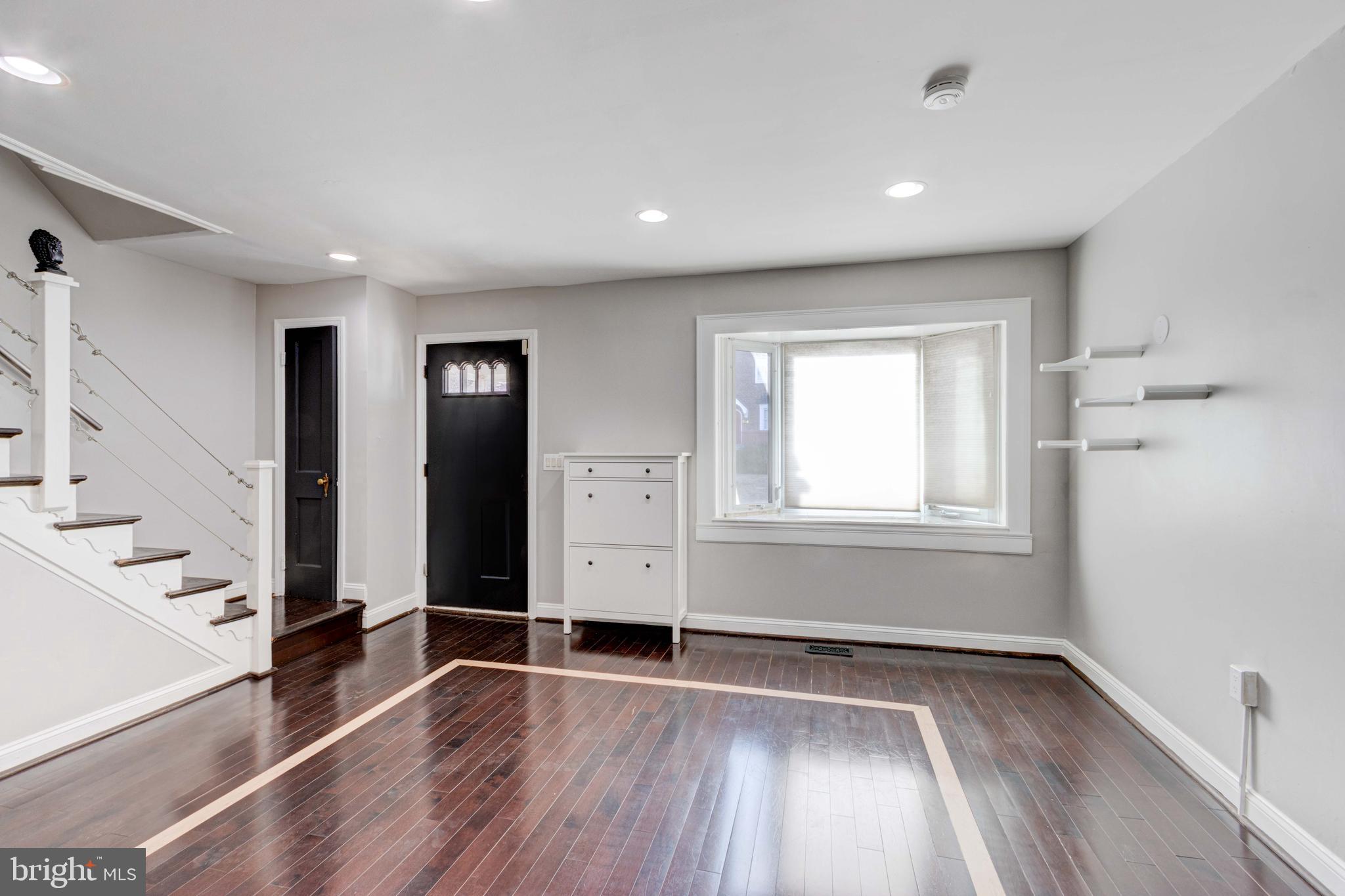 127 Cherrydell Road Catonsville, MD 21228 - Photo 5 of 24 wooden floor in an empty room with a window