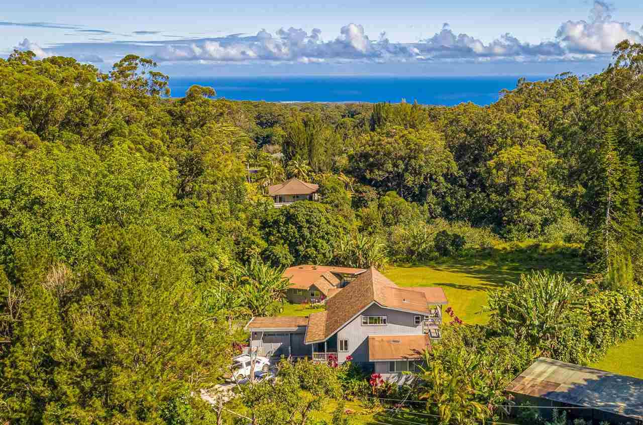 a view of a yard with an outdoor seating