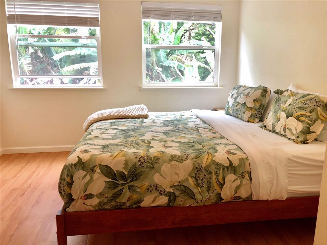 303 Waipalani Road Haiku, HI 96708 - Photo 11 of 29 a bedroom with a bed and a window