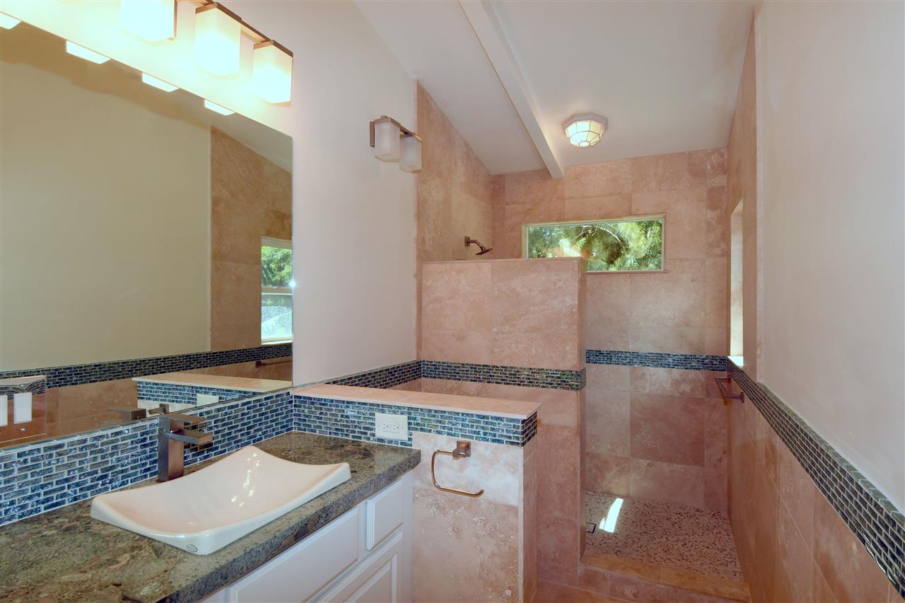 303 Waipalani Road Haiku, HI 96708 - Photo 15 of 29 a view of a kitchen area with furniture and stove