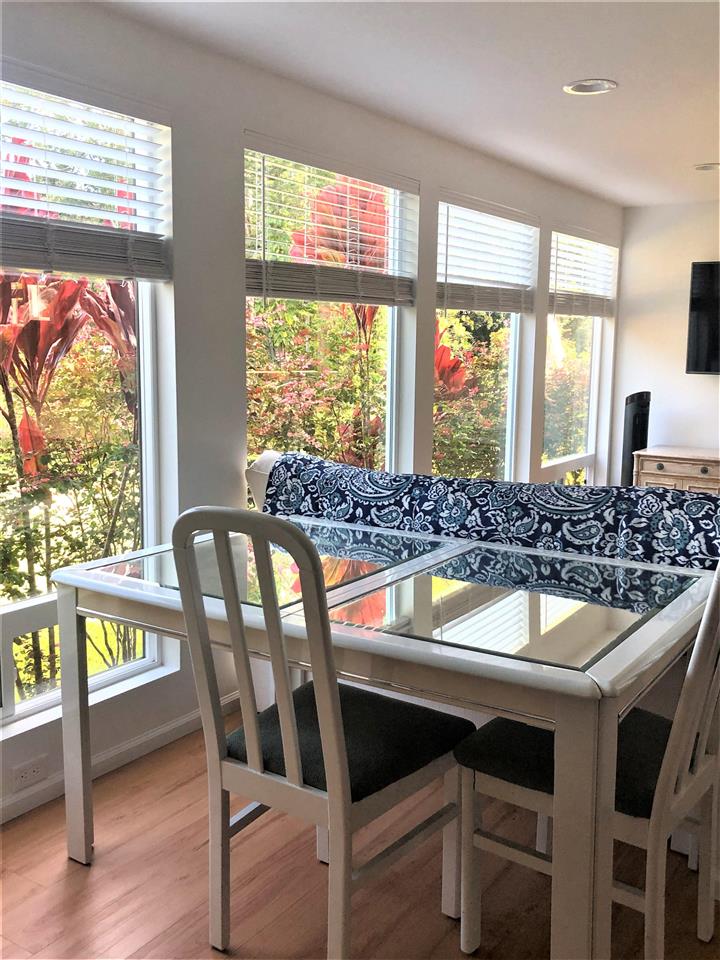 303 Waipalani Road Haiku, HI 96708 - Photo 17 of 29 a dining table chair next to a window