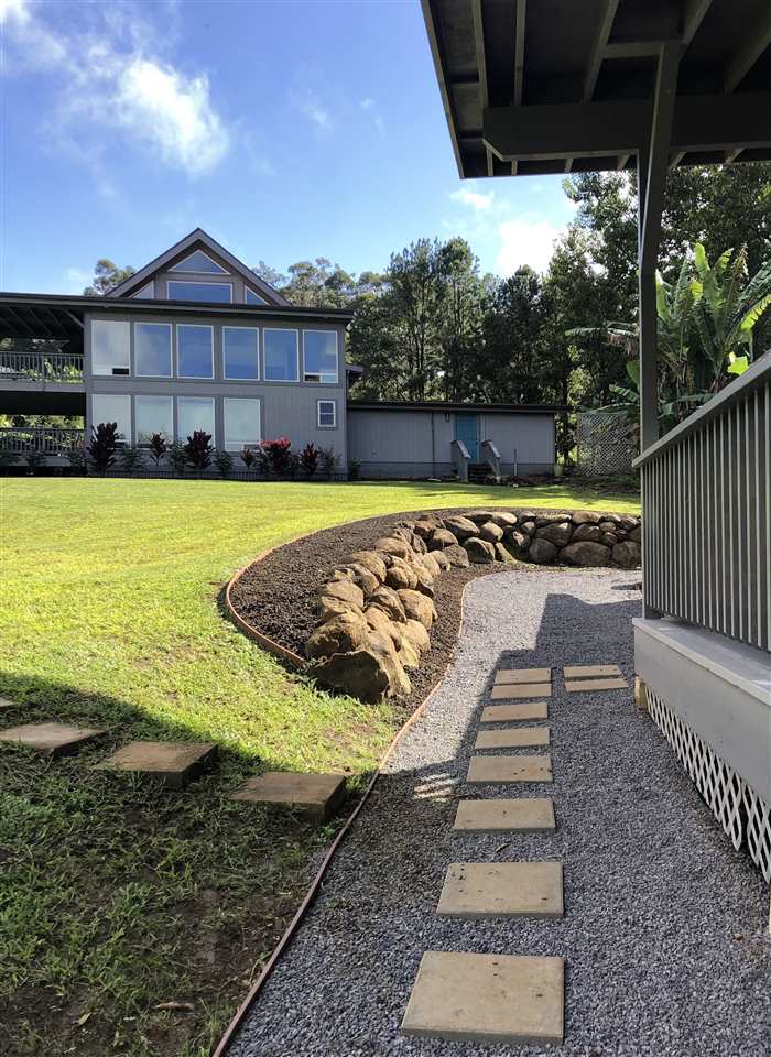 303 Waipalani Road Haiku, HI 96708 - Photo 20 of 29 a view of a swimming pool with a lounge chairs