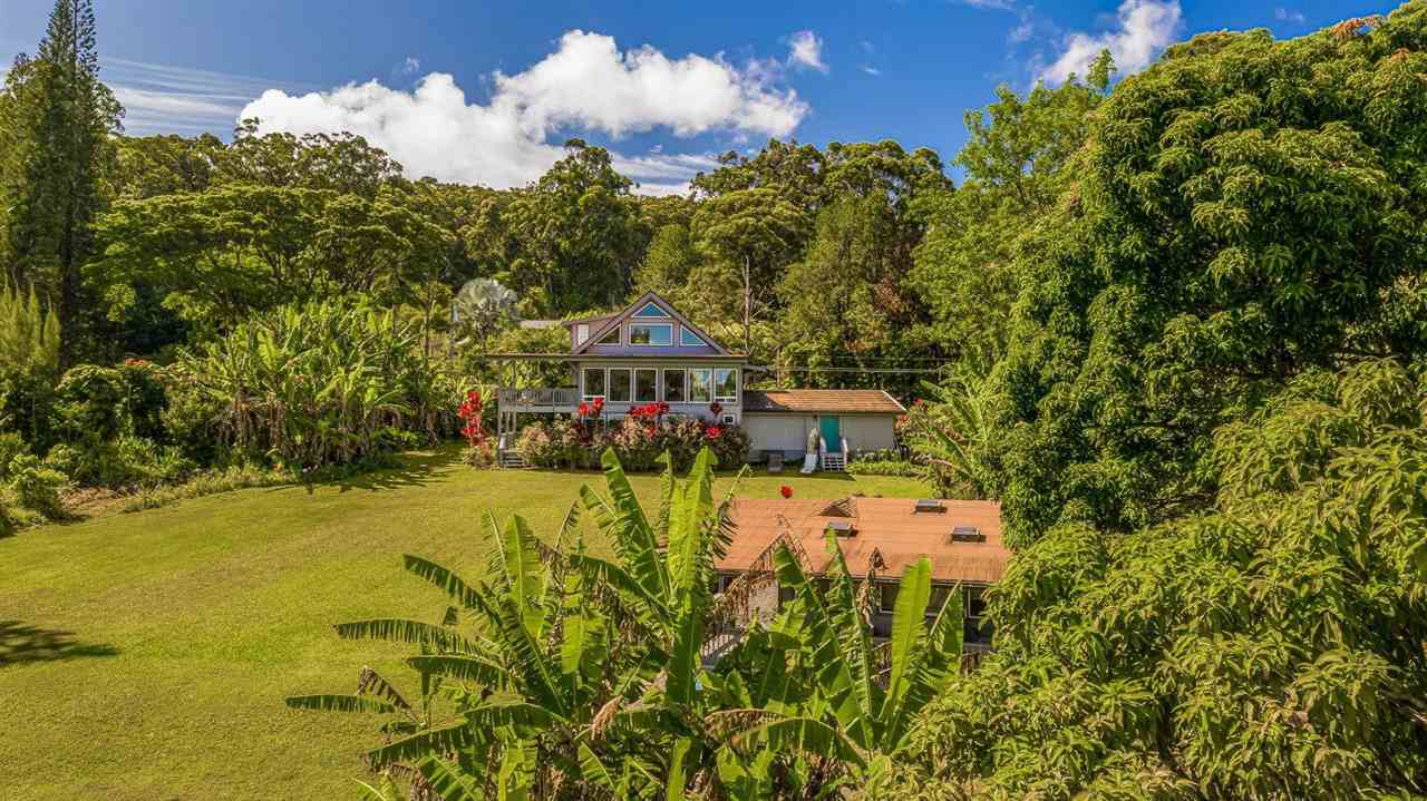 303 Waipalani Road Haiku, HI 96708 - Photo 24 of 29 a view of a swimming pool with a yard