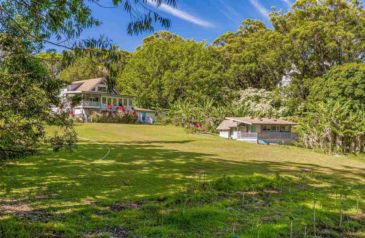 303 Waipalani Road Haiku, HI 96708 - Photo 5 of 29 a front view of a house with a garden