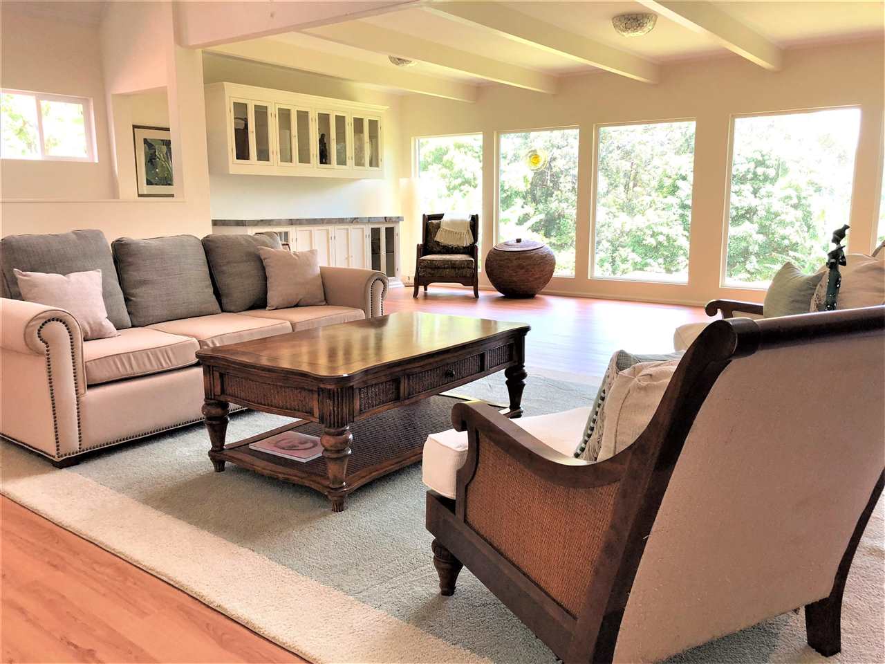 303 Waipalani Road Haiku, HI 96708 - Photo 8 of 29 a living room with furniture and a large window