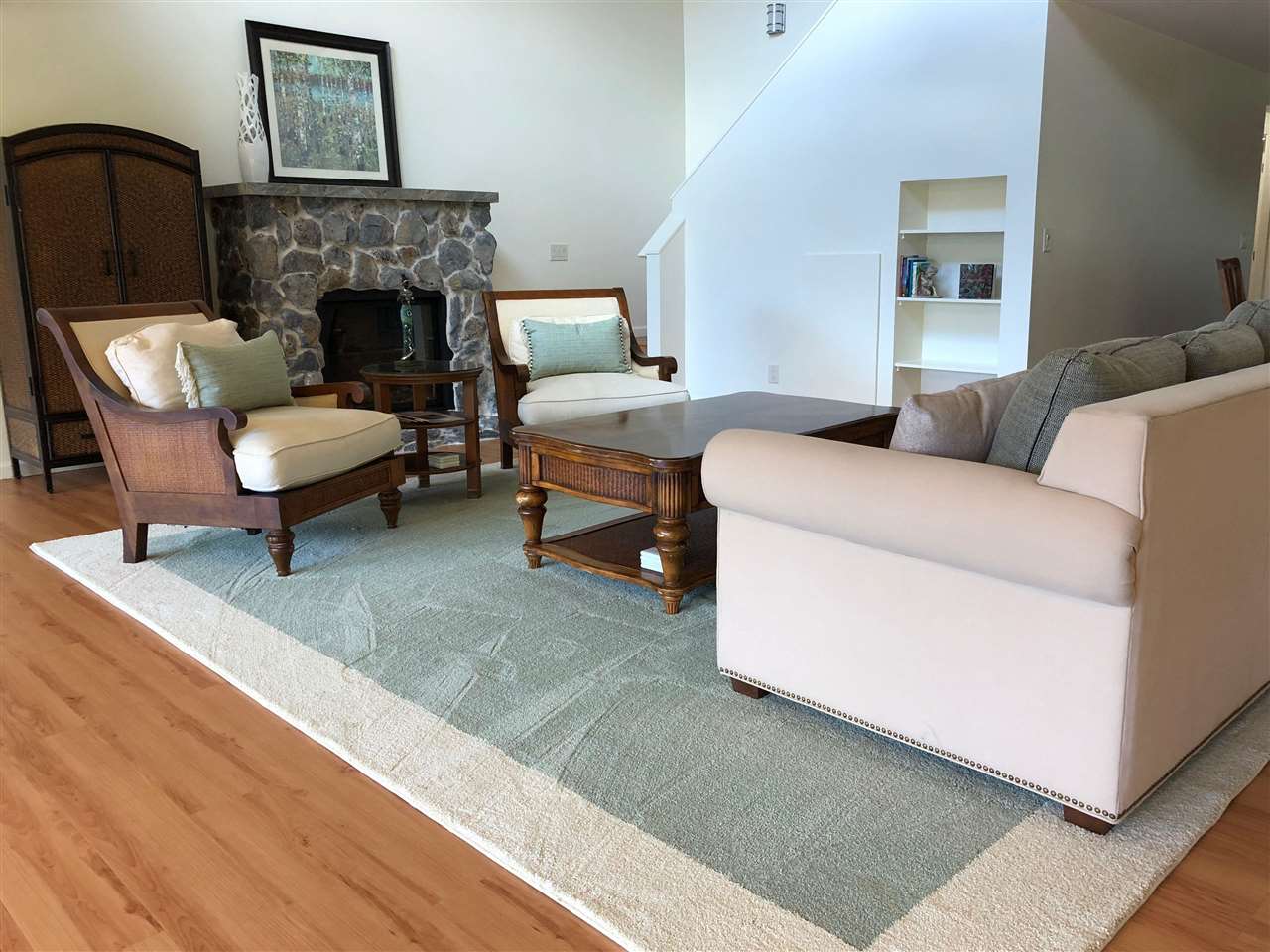 303 Waipalani Road Haiku, HI 96708 - Photo 10 of 29 a living room with furniture and a fireplace