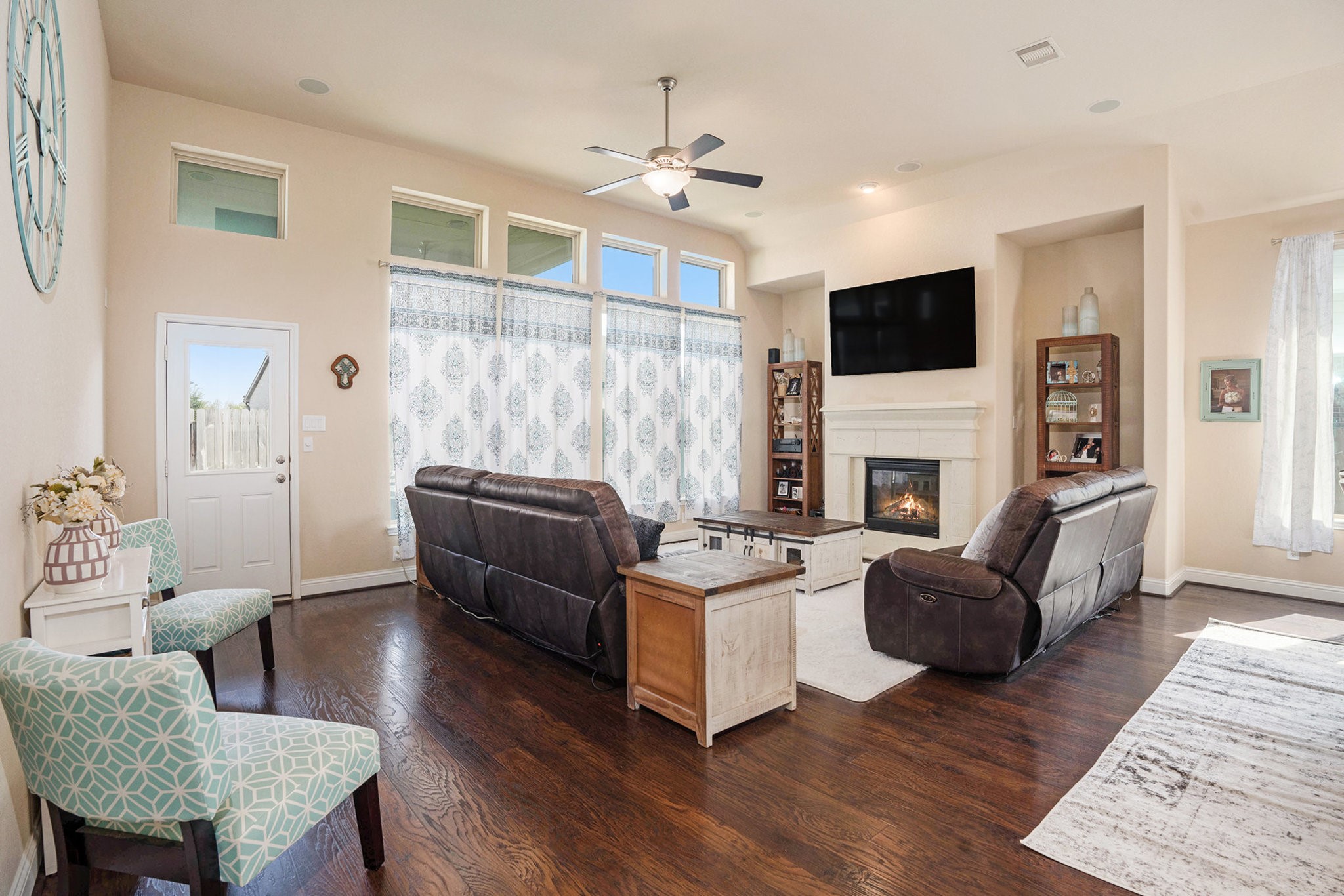17438 Farm Pasture Trail Hockley, TX 77447 - Photo 14 of 25 a living room with furniture a flat screen tv and a fireplace