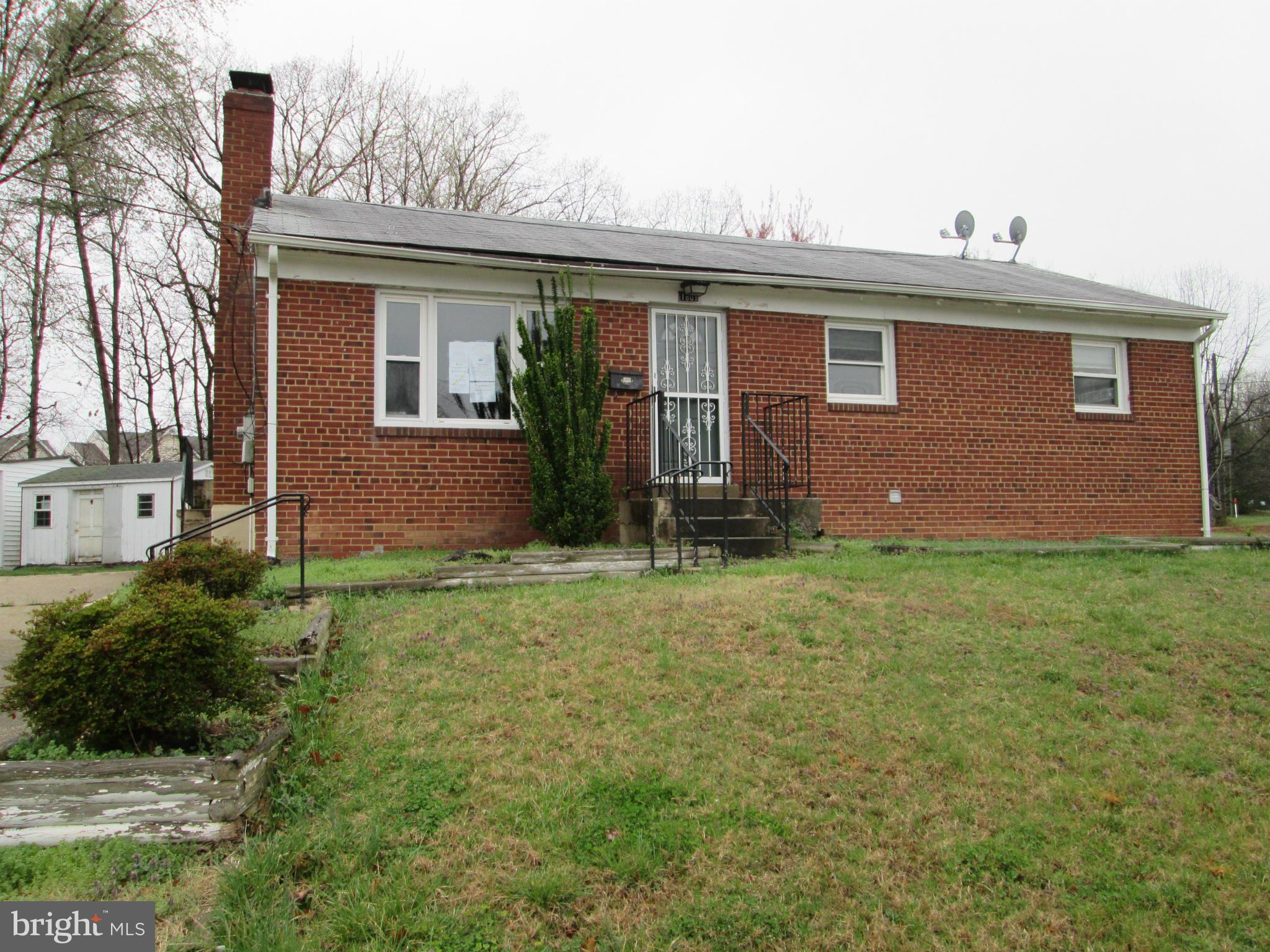 1801 Horner Road Woodbridge, VA 22191 - Photo 1 of 11 a front view of house with yard and green space