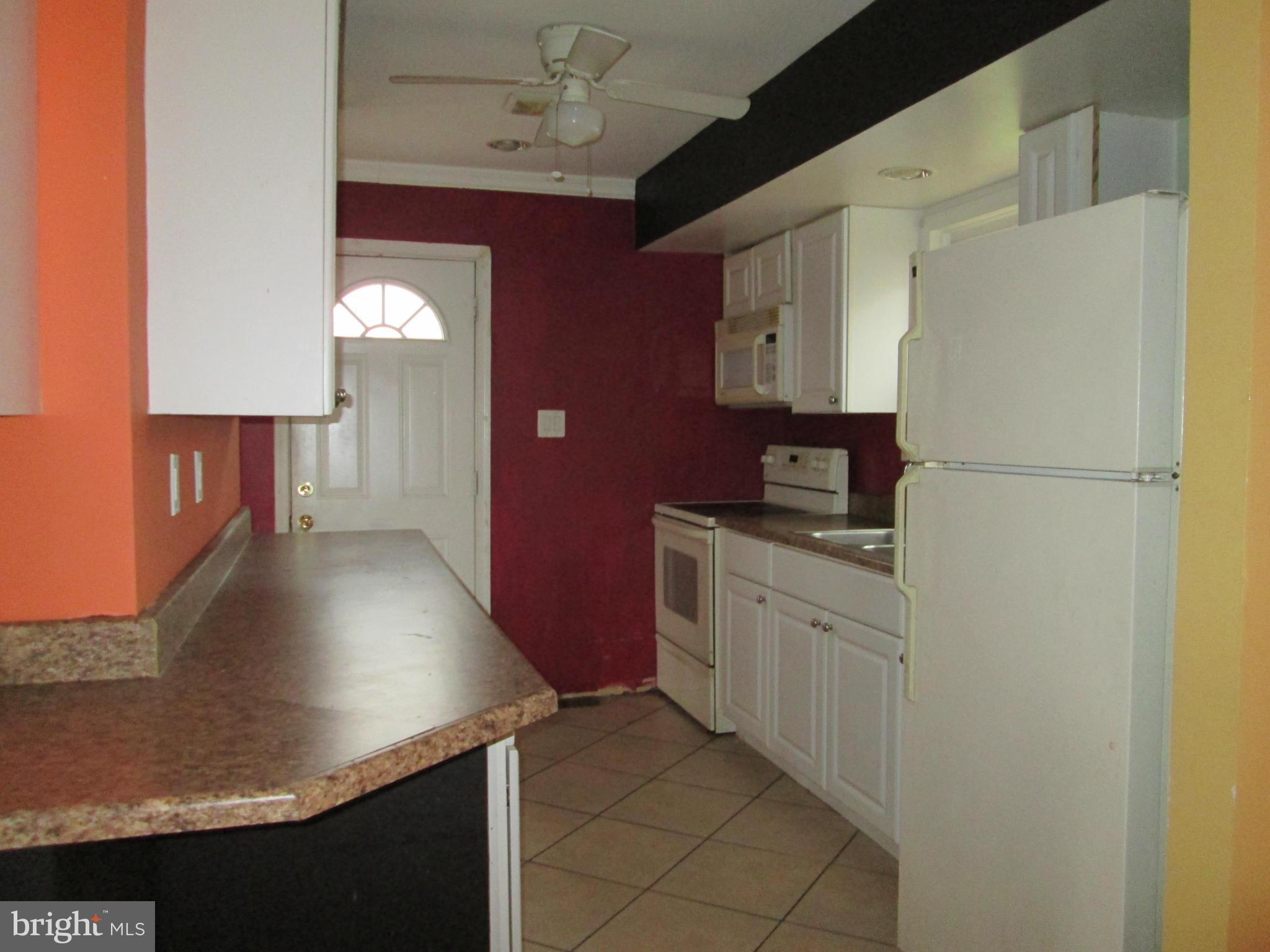 1801 Horner Road Woodbridge, VA 22191 - Photo 5 of 11 a kitchen with stainless steel appliances granite countertop a sink stove and refrigerator
