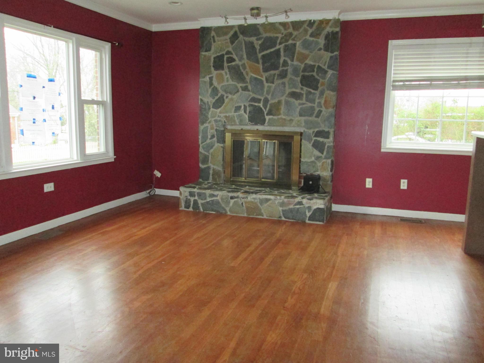 1801 Horner Road Woodbridge, VA 22191 - Photo 8 of 11 a view of empty room with window fireplace and wooden floor