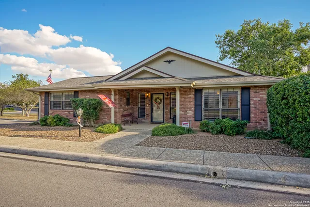 front view of a house with a small yard