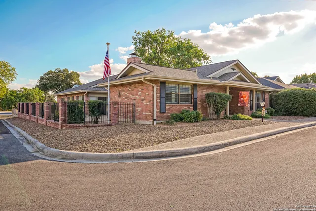 a view of a house with a yard and garage
