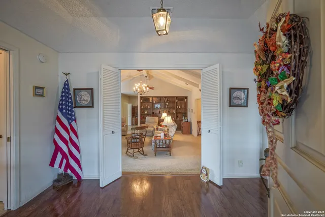 a view of an entryway with wooden floor