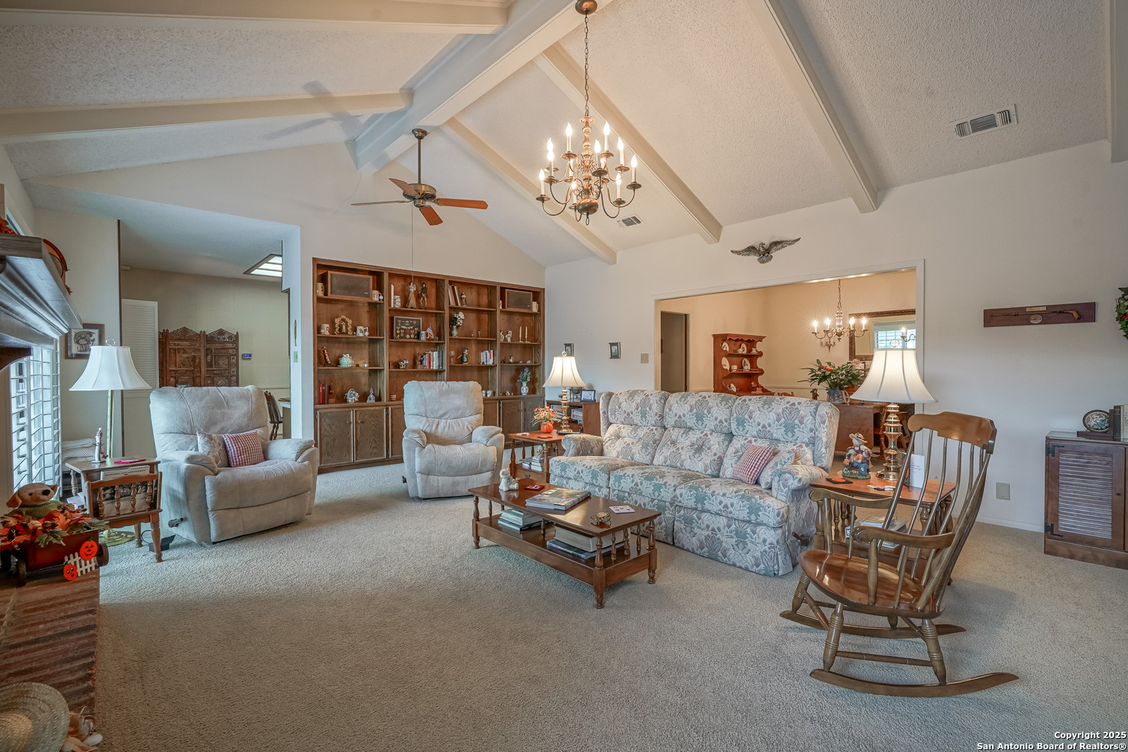 6118 Crescent Falls Windcrest, TX 78239 - Photo 28 of 60 a living room with furniture and a chandelier