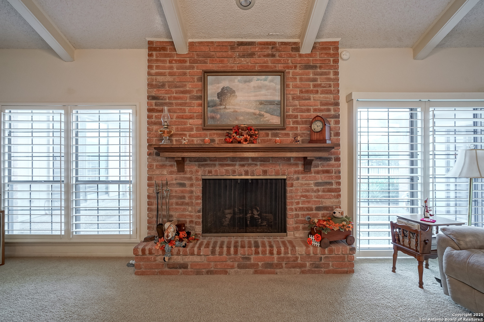 6118 Crescent Falls Windcrest, TX 78239 - Photo 29 of 60 a living room with furniture and a fireplace