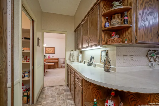 a bathroom with a sink toilet and mirror