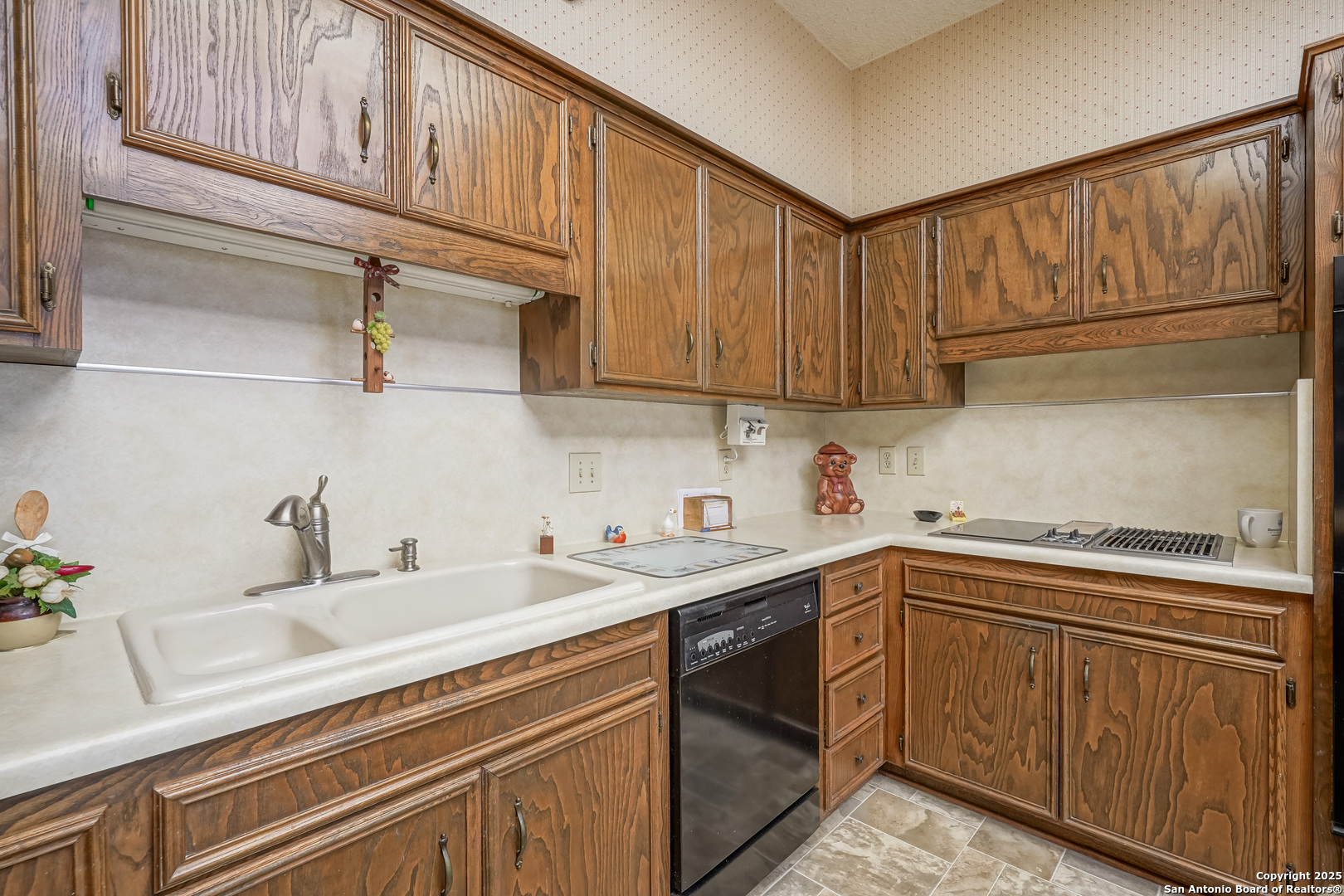 6118 Crescent Falls Windcrest, TX 78239 - Photo 39 of 60 a kitchen with a sink cabinets and appliances