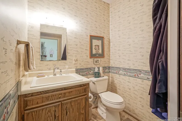 a spacious bathroom with a shower sink and mirror