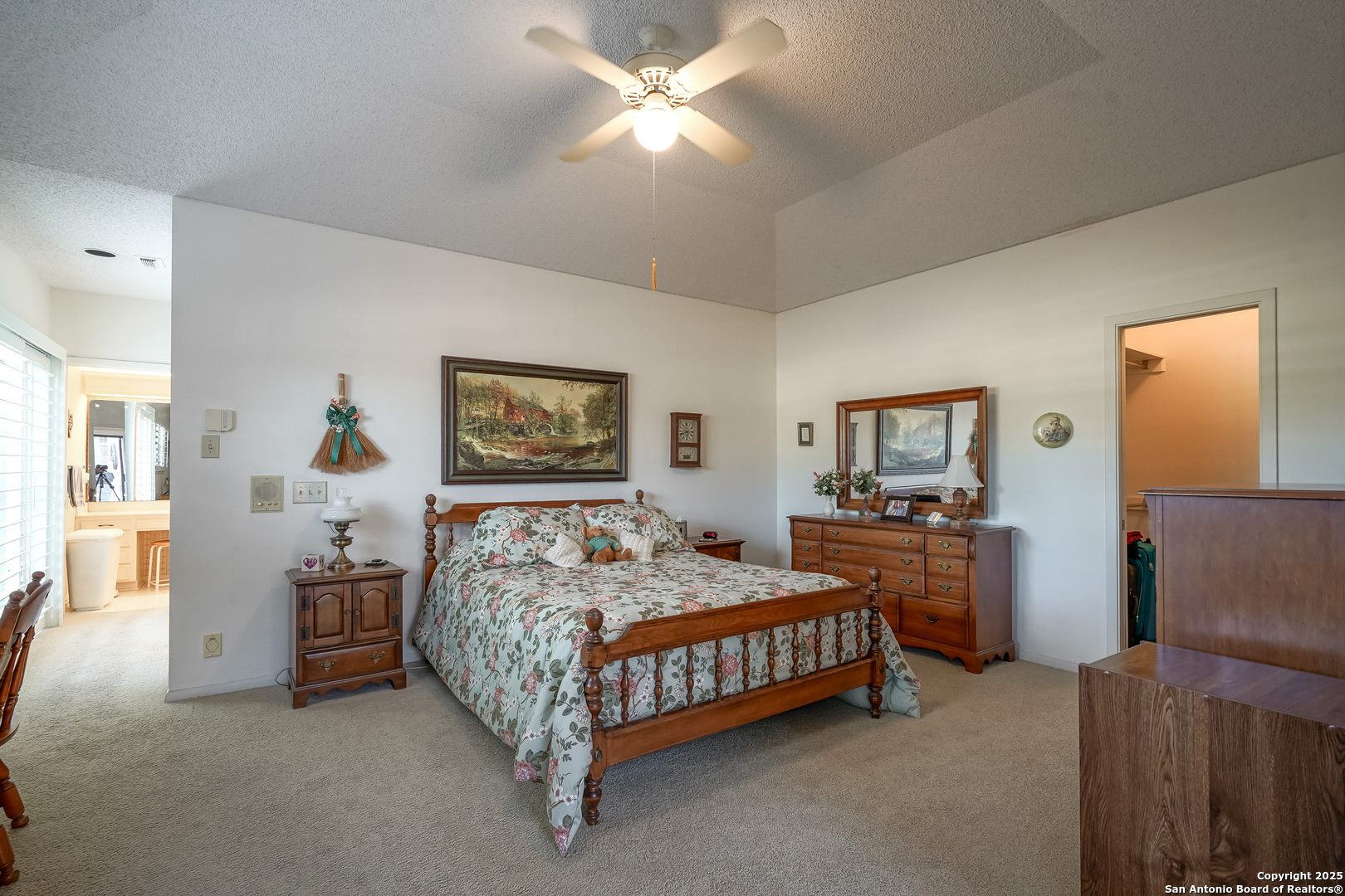 6118 Crescent Falls Windcrest, TX 78239 - Photo 48 of 60 a bedroom with a bed and a chandelier
