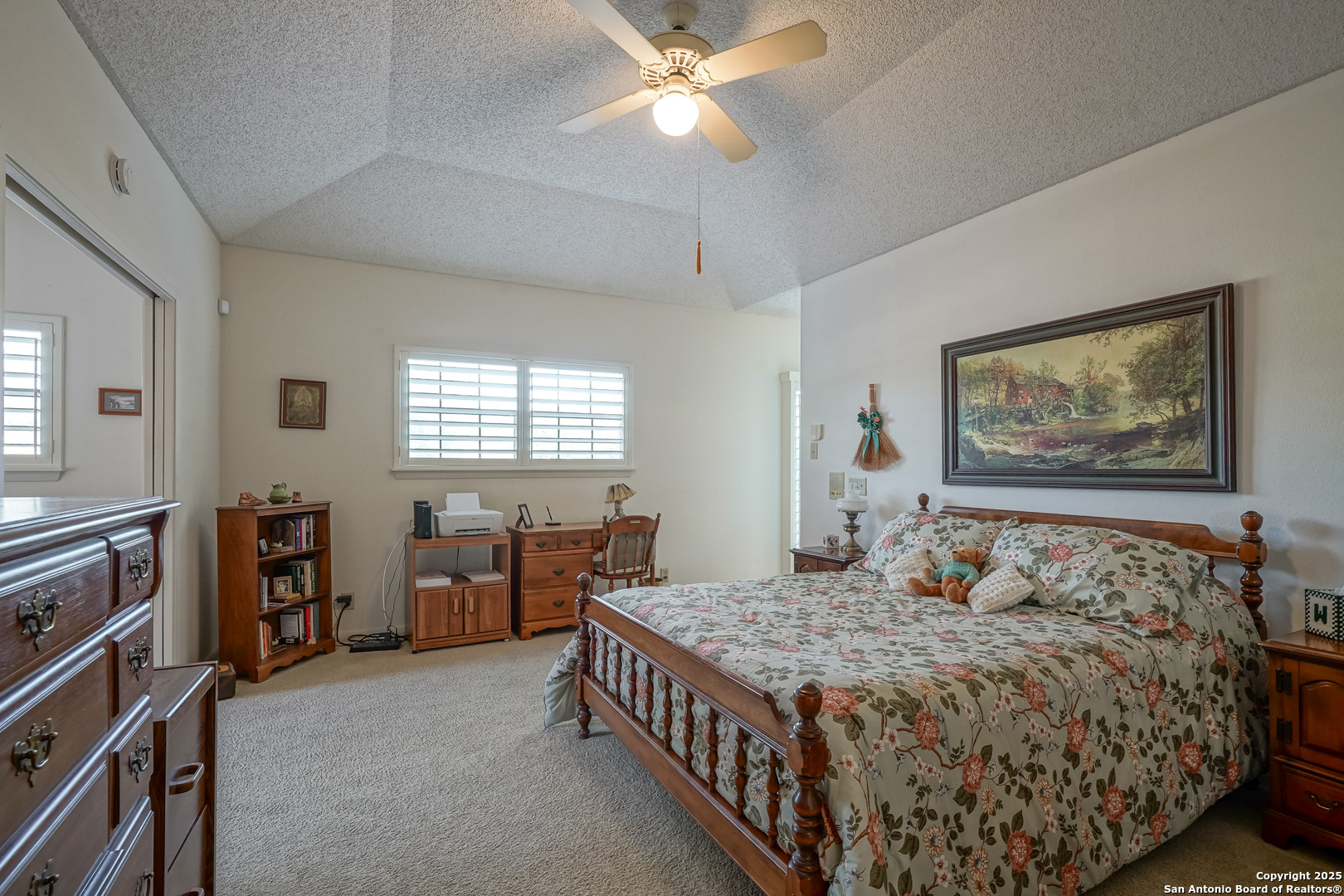 6118 Crescent Falls Windcrest, TX 78239 - Photo 50 of 60 a bedroom with a bed and a chandelier